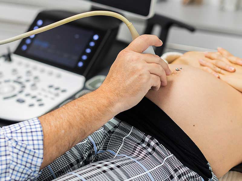 Healthcare provider performing early pregnancy ultrasound in Durham, NC